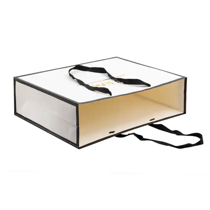 White Shopping Paper Bags for Boutique Retail Logo Print with Gold Stamp And Ribbon Handles
